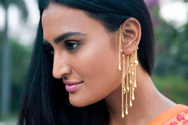 Gold Hanging Ear Cuffs by Payal Pratap.